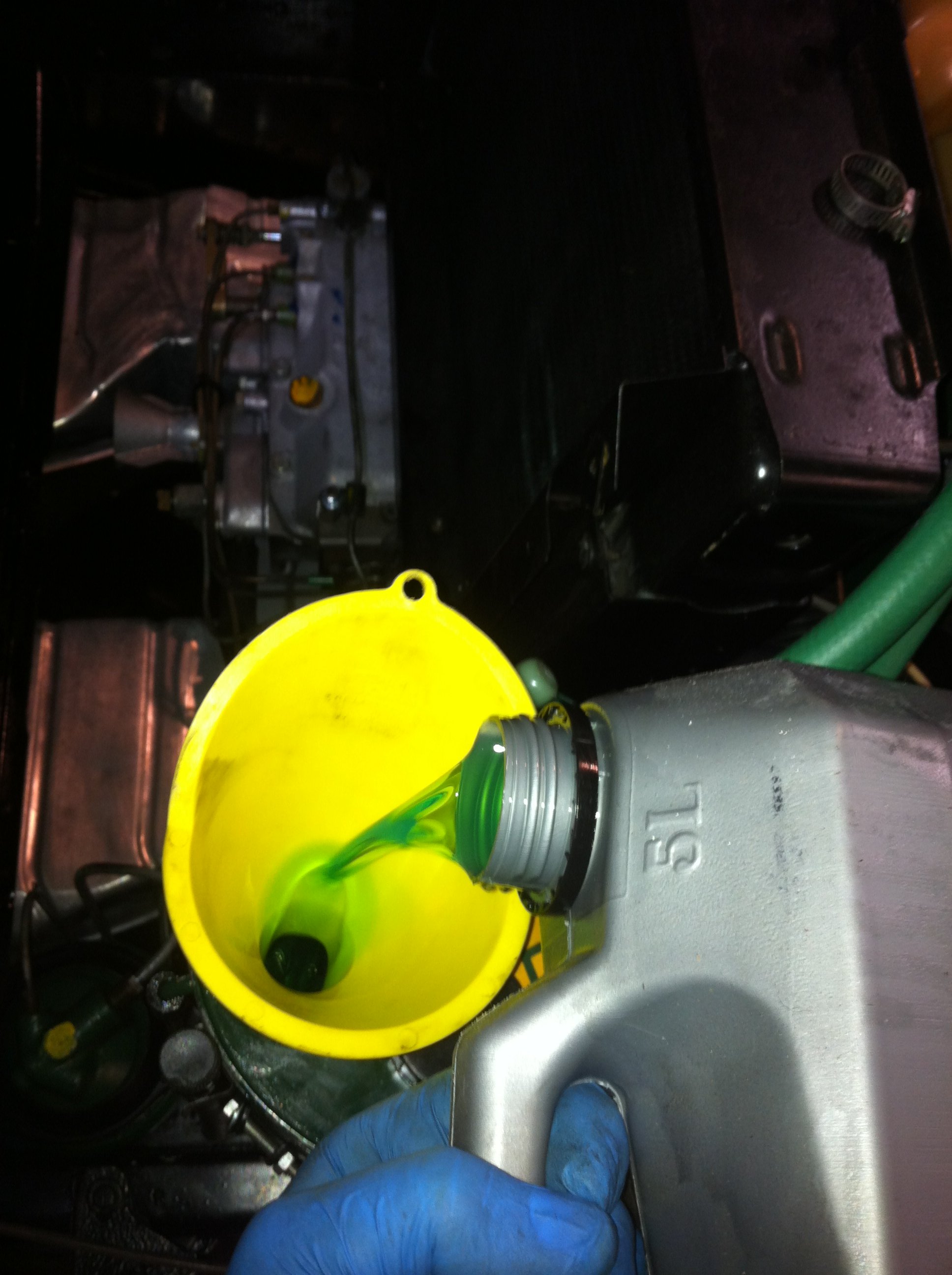 I pour new LHM fluid into the hydraulic reservoir