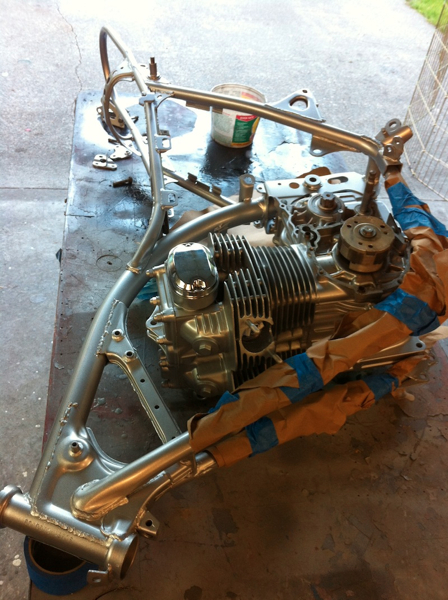 I lay the engine on the table and install the frame around it, easy job for one person!