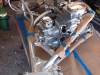 I use the HondaTwins.Net trick of laying the engine down and installing the frame over the engine - much easier than trying to get the engine in the frame while it is upright on its wheels