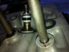 It is apparent that the seal was never pushed down onto the brass exhaust guides